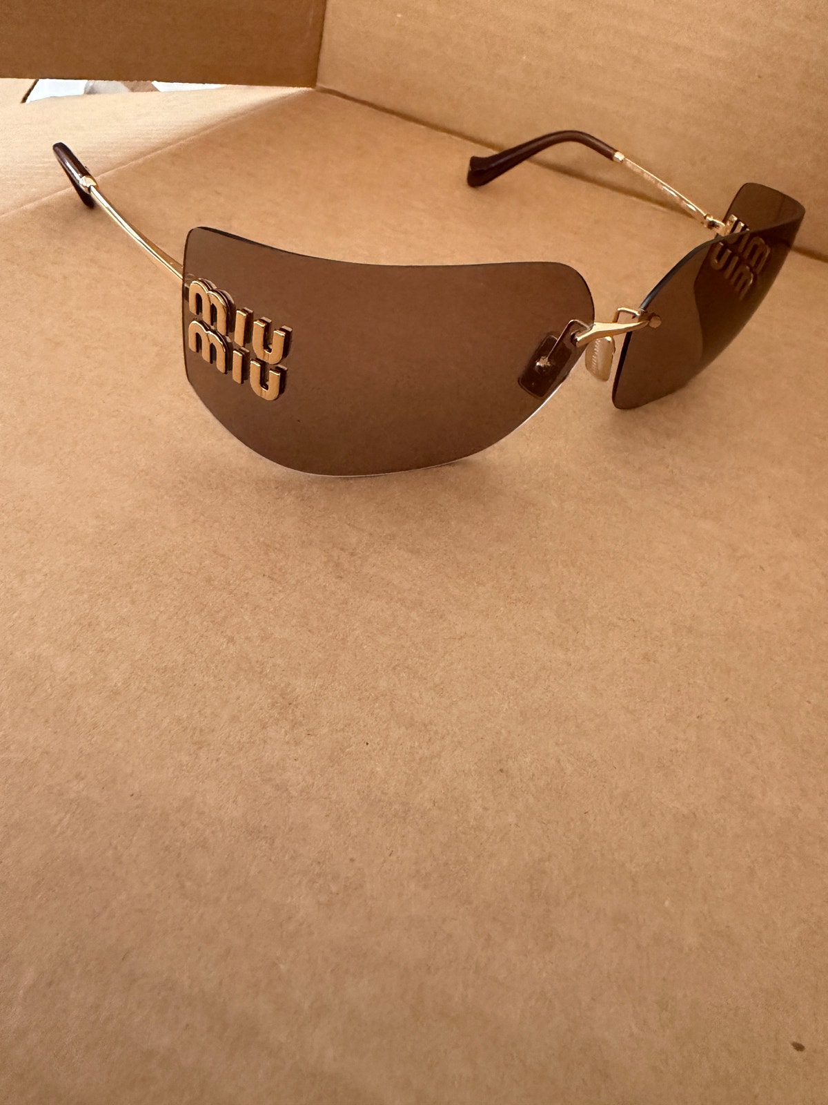 Miu Miu Runway Rimless Sunglasses Mauve Brown